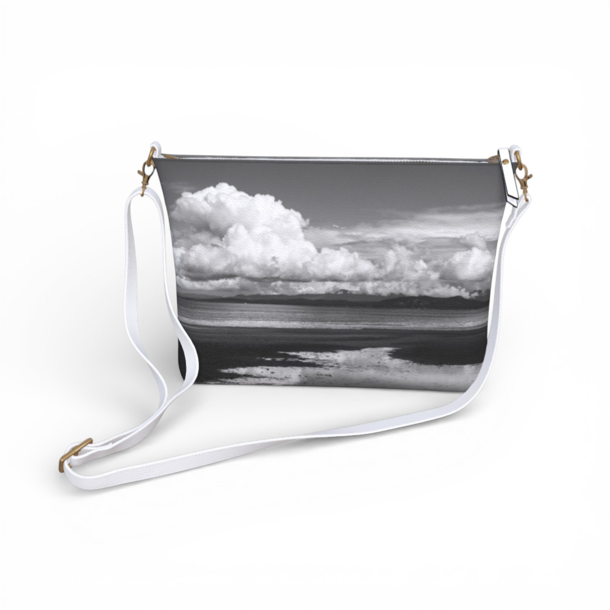 Van Isle Goddess Parksville Beach crossbody purse with a black and white landscape print, vegan leather, and adjustable white strap.