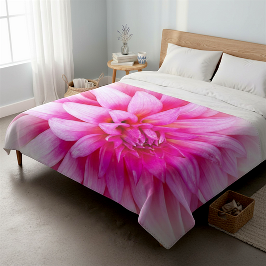 Van Isle Goddess pink dahlia floral minky fabric blanket with grey backing and blanket stitch finish.