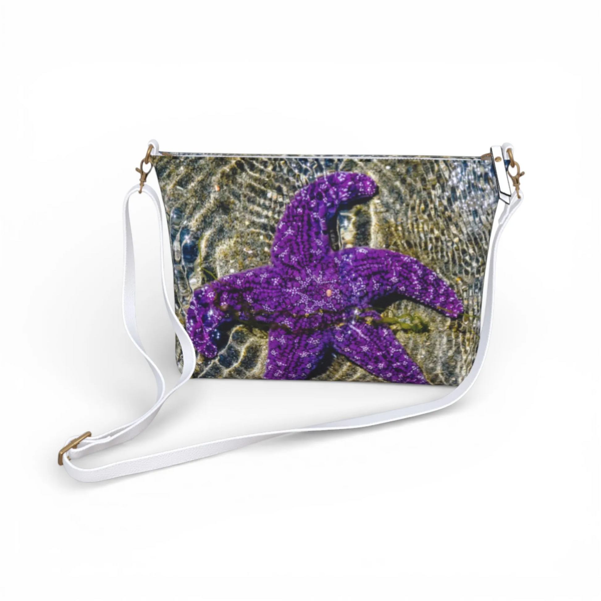 Van Isle Goddess purple starfish vegan leather crossbody purse with adjustable white strap.