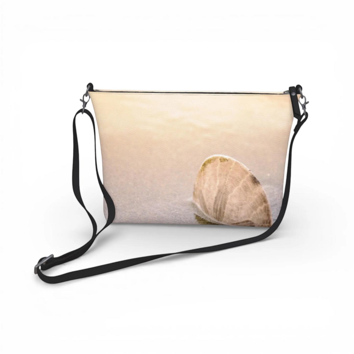Van Isle Goddess sand dollar print vegan leather crossbody purse with adjustable strap and metal hardware. Beige and tan.