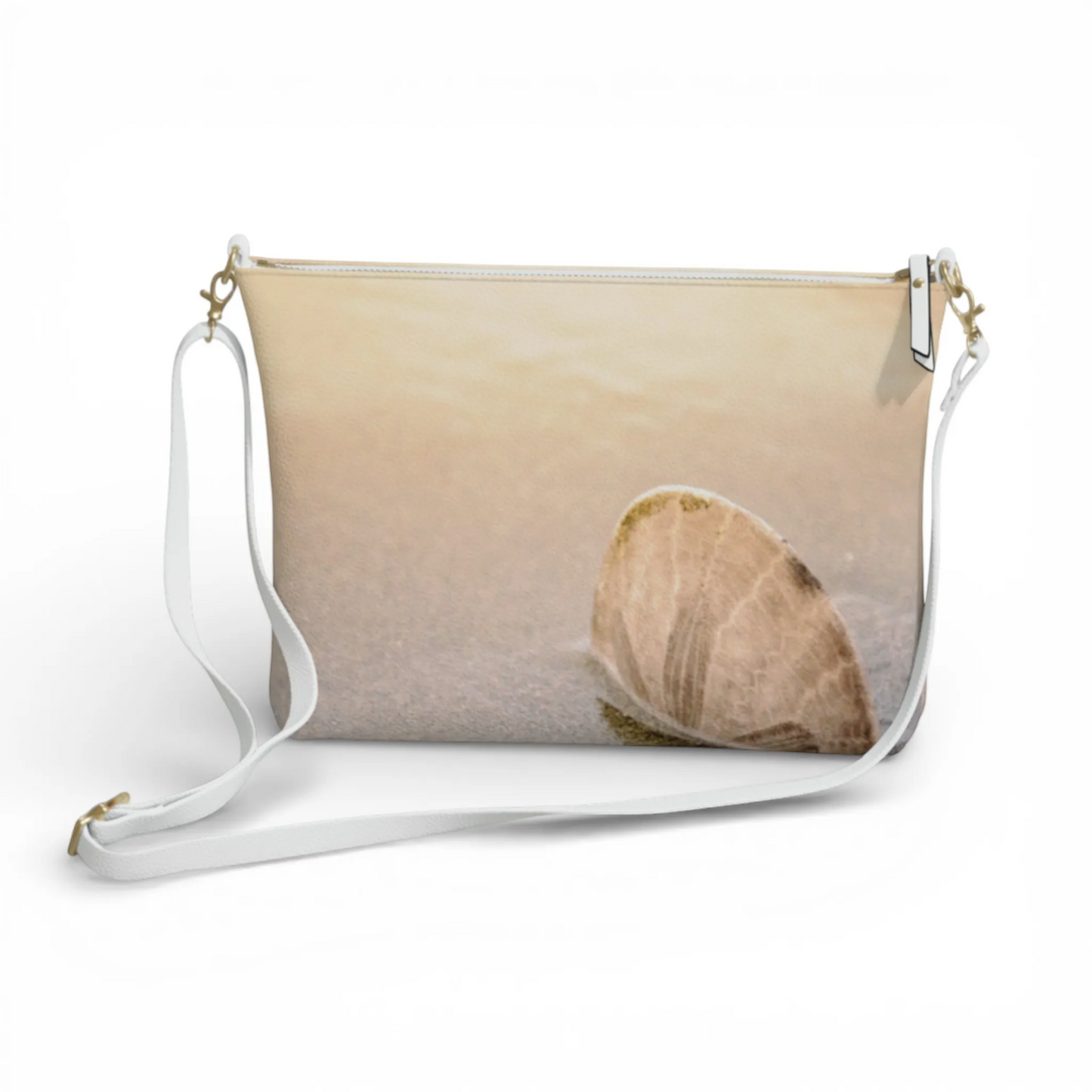 Van Isle Goddess sand dollar vegan leather crossbody purse with adjustable white strap and gold hardware.