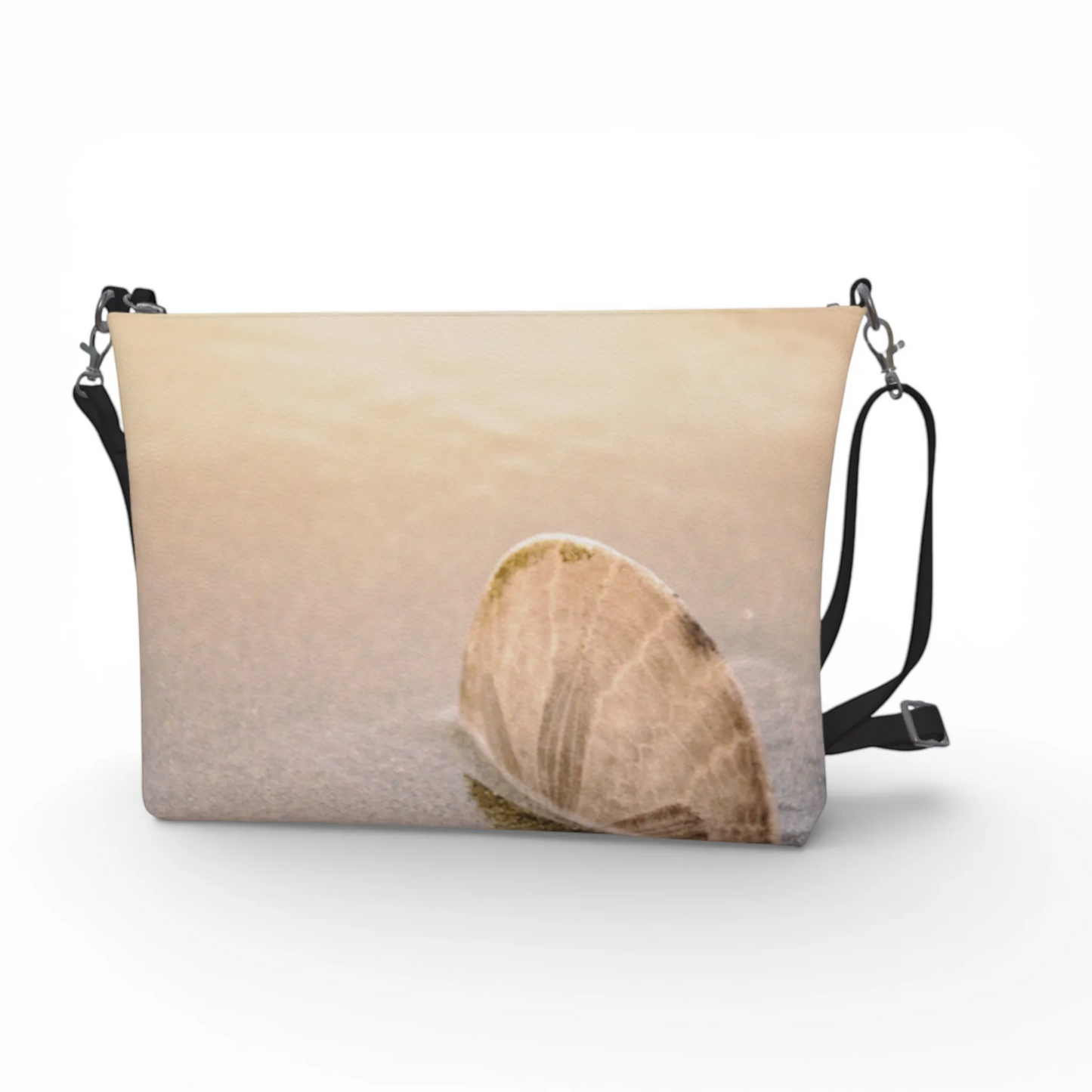 Van Isle Goddess sand dollar vegan leather crossbody purse with adjustable strap and metal hardware. Textured pebble leather.