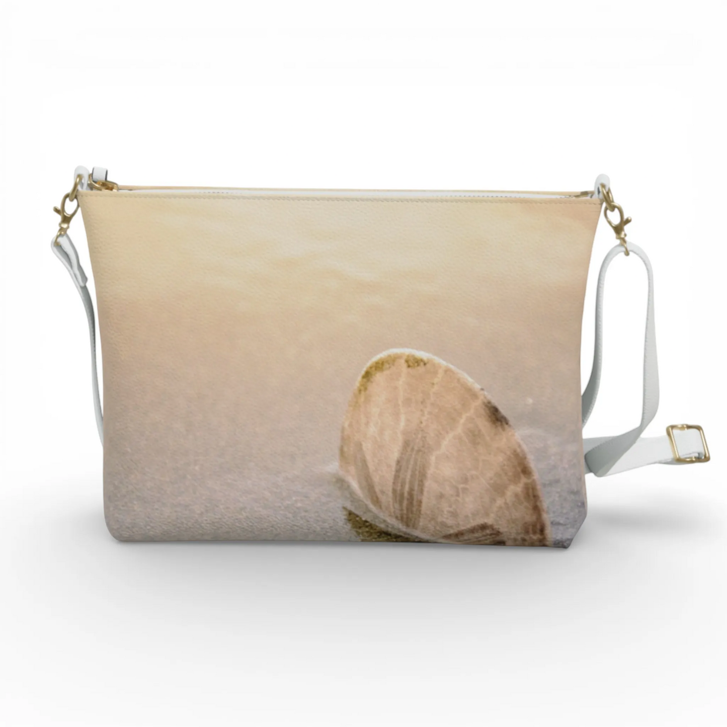 Van Isle Goddess sand dollar vegan leather crossbody purse with adjustable strap and gold hardware.