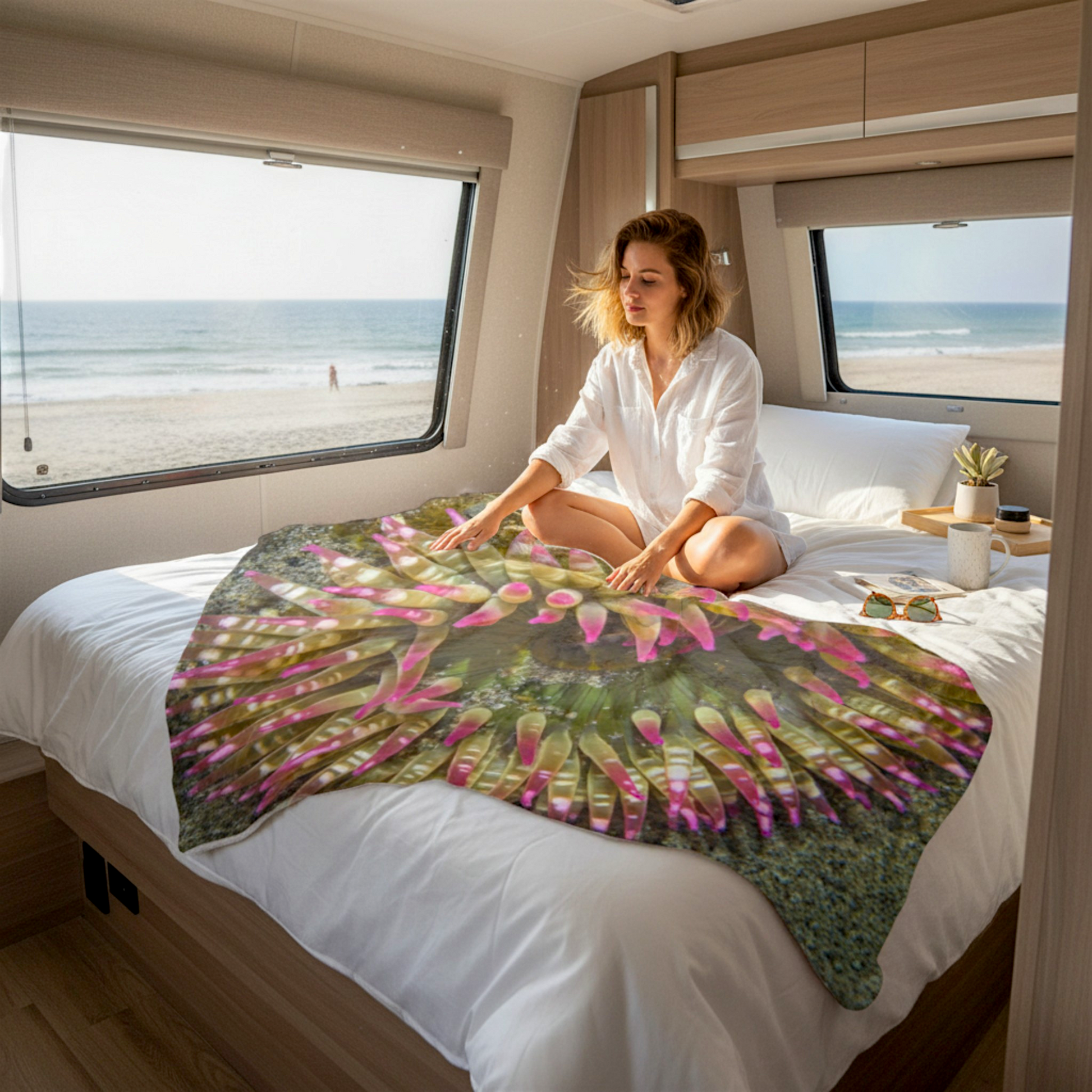 Van Isle Goddess Sea Anemone blanket with pink tentacles, green body, and sandy texture. Made of soft polyester minky fabric.