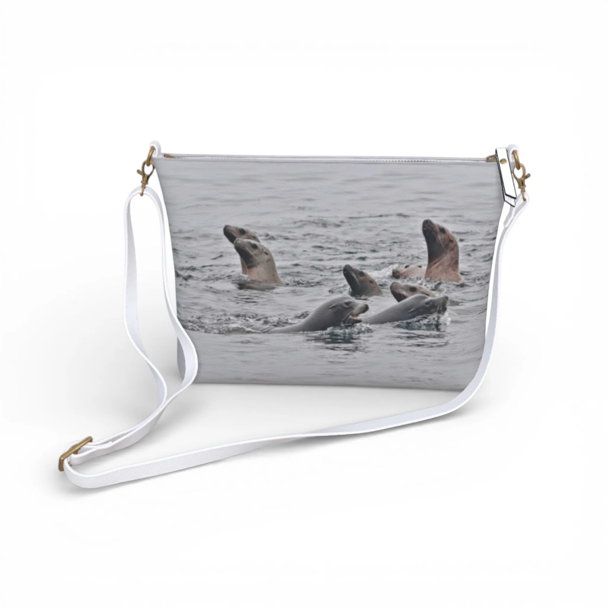 Van Isle Goddess Sea Lions vegan leather crossbody purse with adjustable strap and sea lions graphic print.