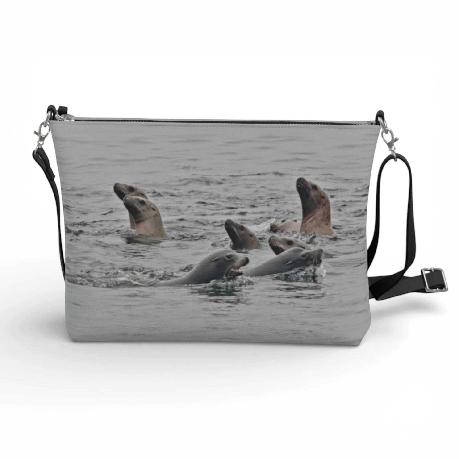 Van Isle Goddess Sea Lions vegan leather crossbody purse with adjustable strap and zipper closure.