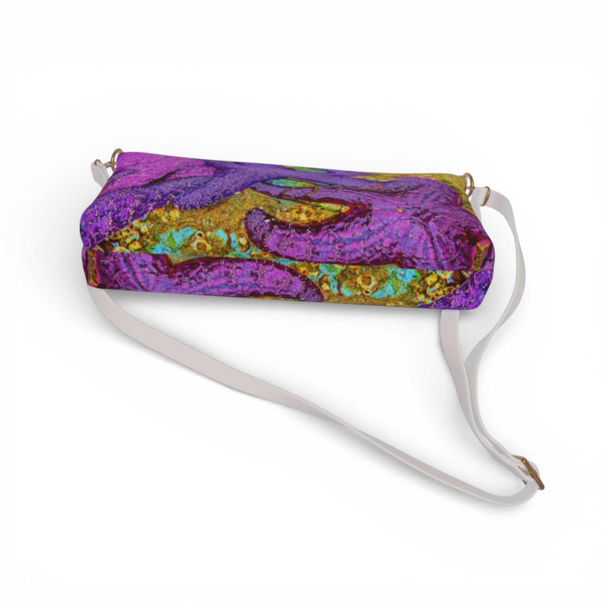 Van Isle Goddess Alberni Inlet crossbody purse in vegan leather with a vibrant purple, gold, and teal abstract print. Features adjustable strap.