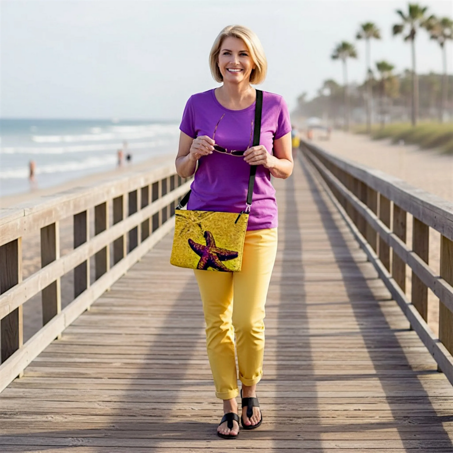 Van Isle Goddess Star Track crossbody purse with starfish print, vegan leather, adjustable strap, metal zipper. Perfect for beach trips.