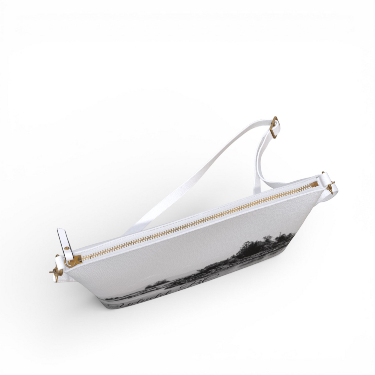 Van Isle Goddess Ucluelet vegan leather crossbody purse with adjustable strap and gold zipper. Features a black and white landscape print.