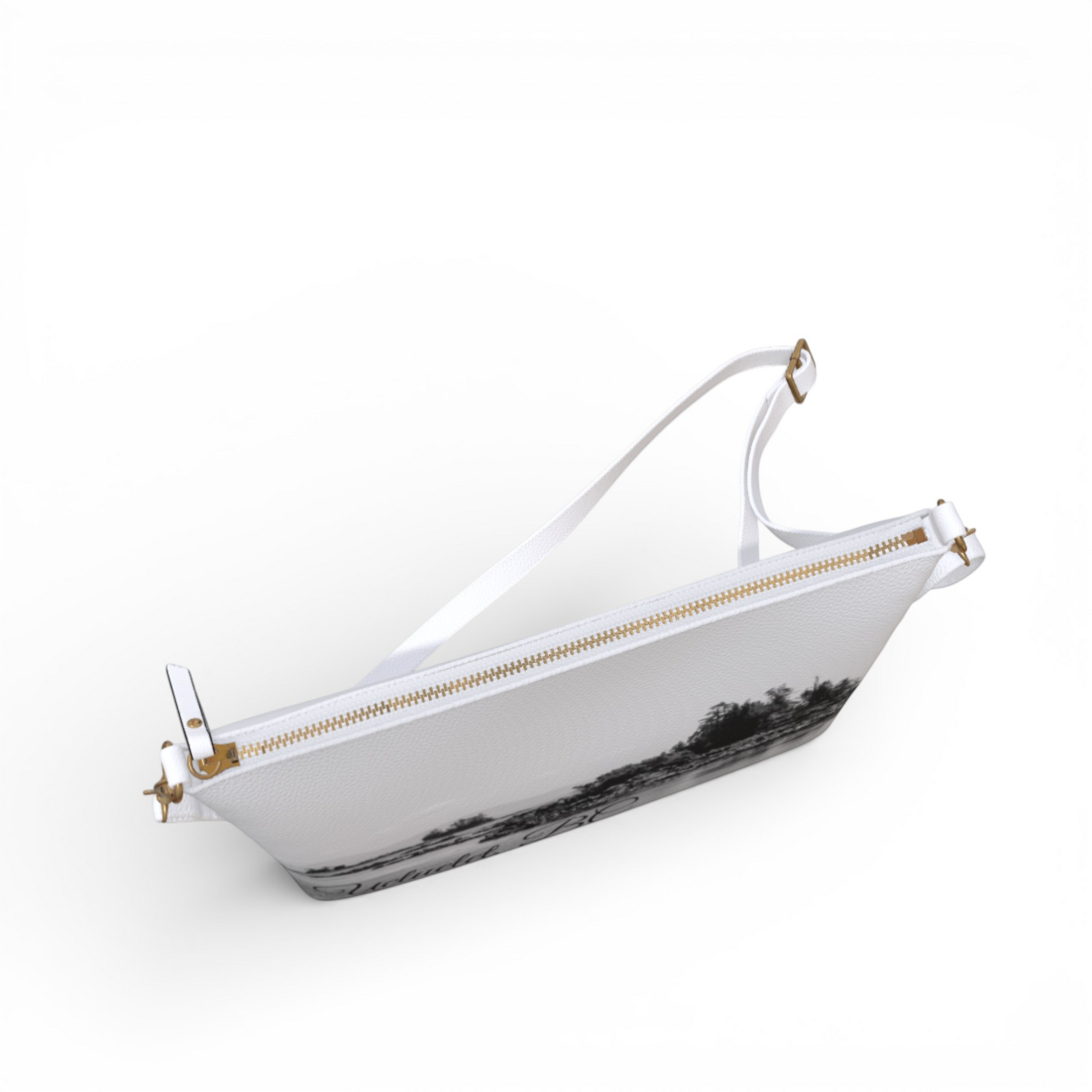 Van Isle Goddess Ucluelet vegan leather crossbody purse with adjustable strap and gold zipper. Features a black and white landscape print.