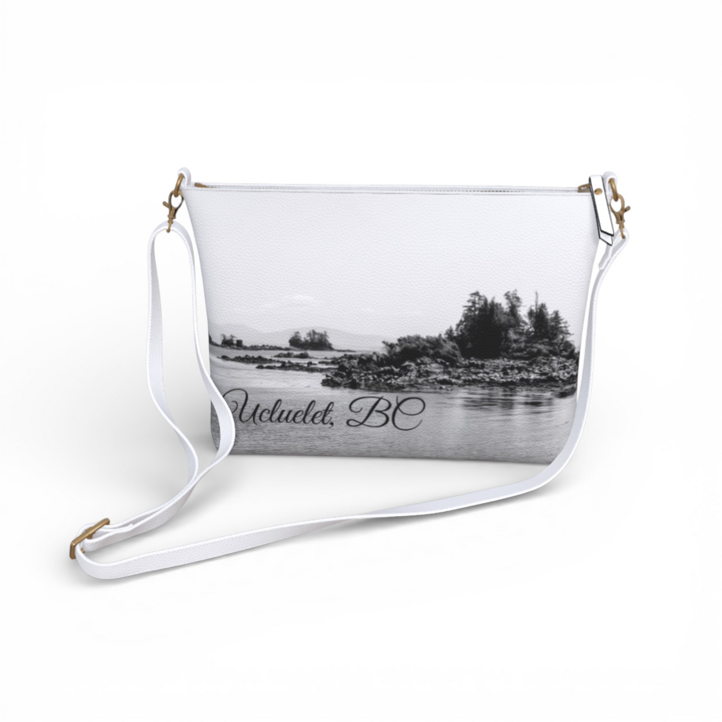 Van Isle Goddess Ucluelet crossbody purse in white vegan leather with a black and white landscape print and adjustable strap.