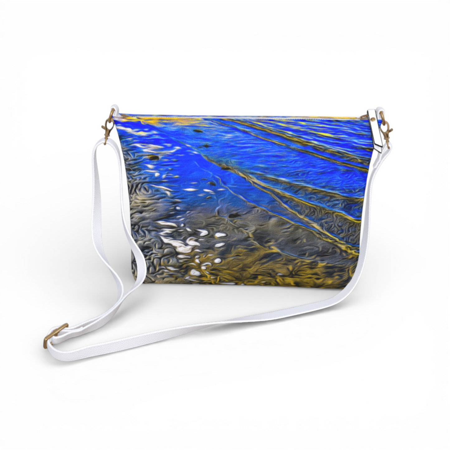 Van Isle Goddess Ebb & Flow vegan leather crossbody purse with abstract blue and gold water print, adjustable white strap.