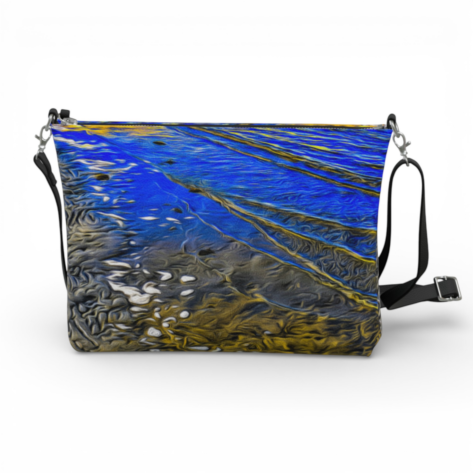 Van Isle Goddess Ebb & Flow crossbody purse in vegan leather with a blue and gold abstract wave print, adjustable strap, and metal zipper.