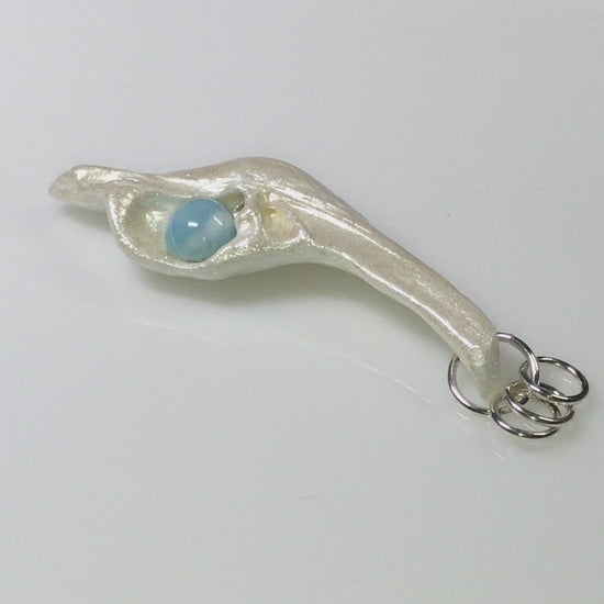 A video showcasing A beautiful 10 mm Round Larimar Gemstone&nbsp;compliments the pendant.