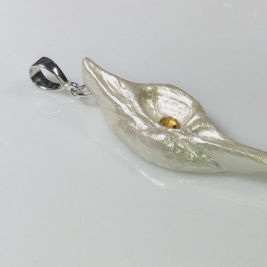 A video Lightmaker natural seashell pendant A beautiful pear shaped rose cut Citrine compliments the pendant.