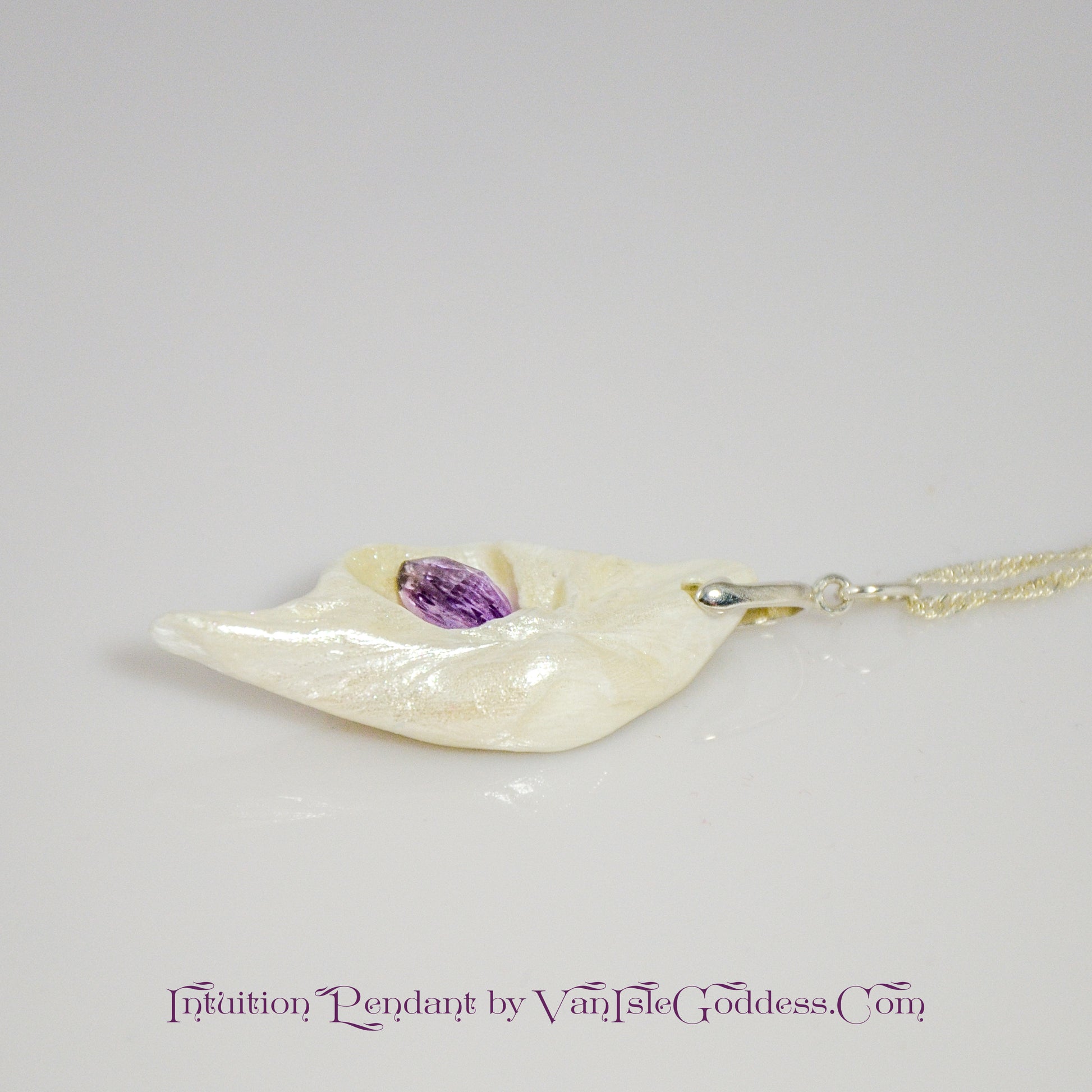 Intuition a natural seashell pendant with a beautiful rose cut marquise Amethyst. 