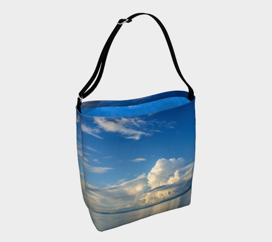 Everyday Day Tote for Everything!  Van Isle Goddess ultimate tote bag!   Adjustable strap for comfort, the tote is made from soft and supple neoprene that stretches to fit whatever you can put in it!    Vibrant artwork that will never fade with washing.  Qualicum Beach Artwork by  Roxy Hurtubise with ocean waves interior.