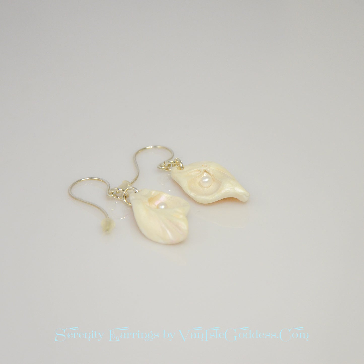 Serenity natural seashell earrings with real baby freshwater pearls.