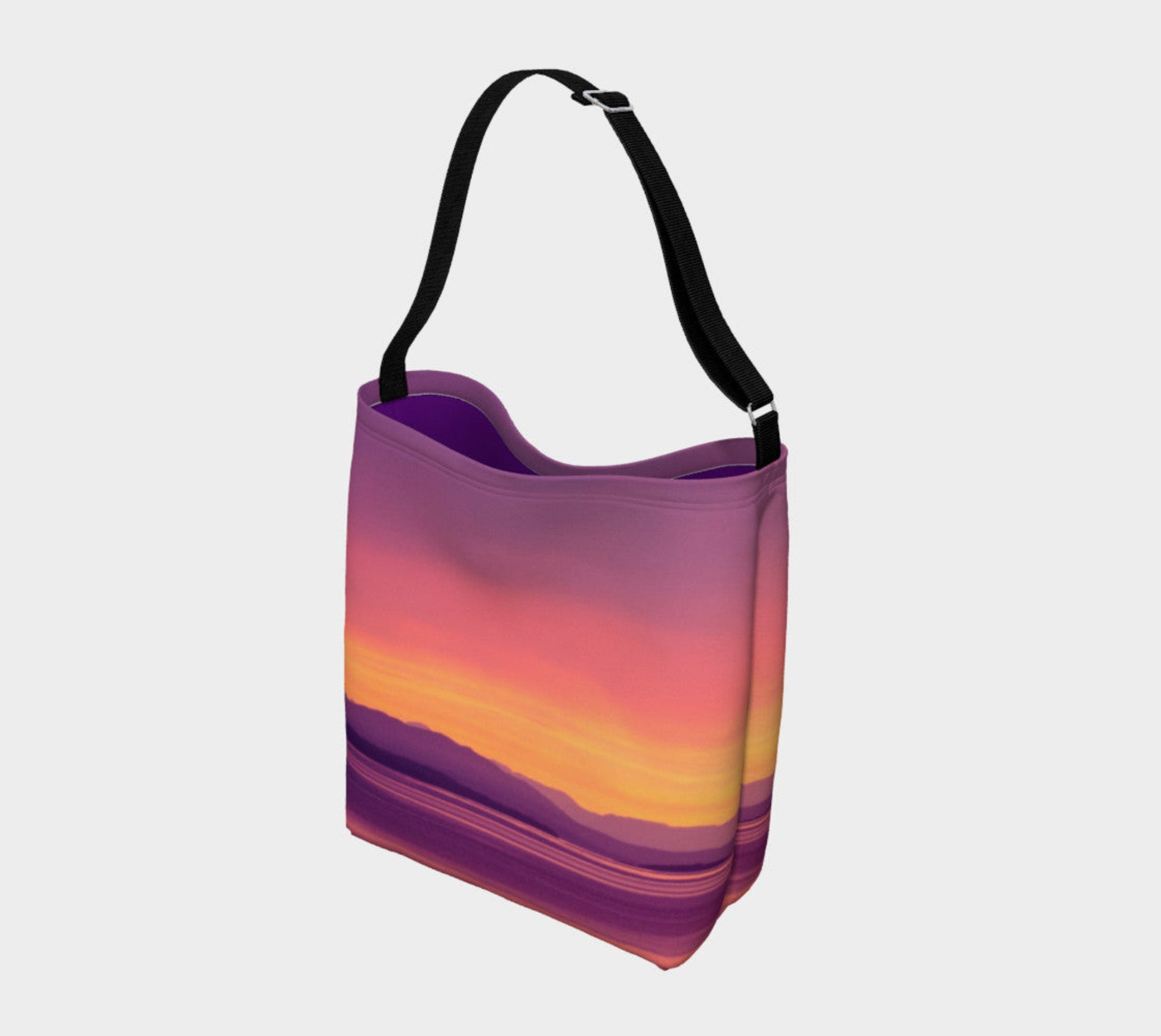 Vancouver Island Sunset Day Tote  Everyday Day Tote for Everything!  Van Isle Goddess ultimate tote bag!   Adjustable strap for comfort, the tote is made from soft and supple neoprene that stretches to fit whatever you can put in it!    Vibrant artwork that will never fade with washing.  Vancouver Island Sunset Artwork by  Roxy Hurtubise with purple interior.