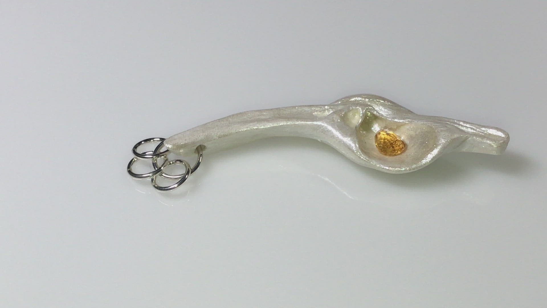 A video showcasing Sun Star natural seashell pendant with a beautiful pear shaped rose cut Citrine.