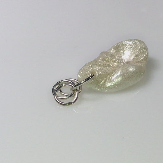 A video showing Jewel natural seashell with a real teardrop shaped rose cut pink tourmaline gemstone compliments the pendant. 