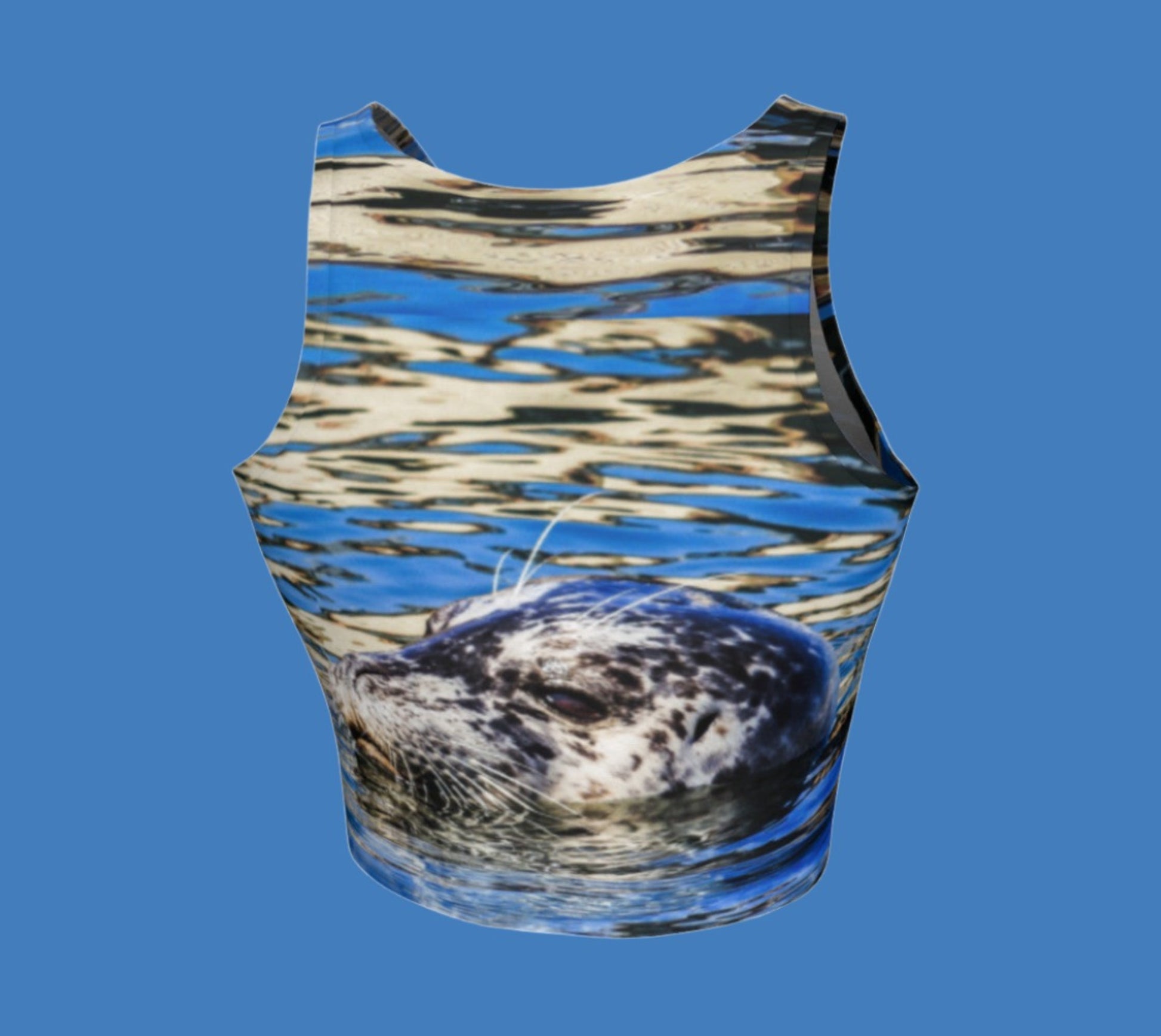 Seal of Blue Active Crop Top  The image on the top is  of a harbour seal in blue ocean water.
