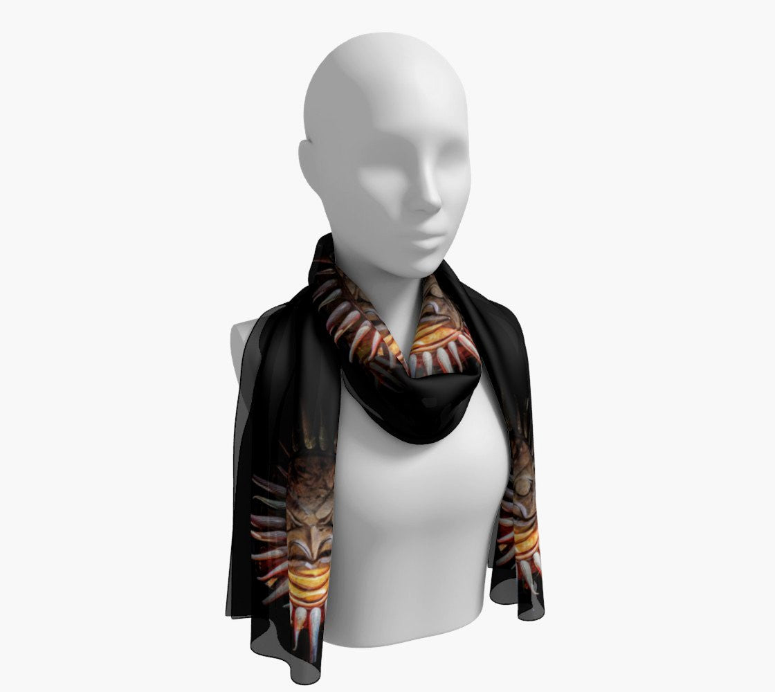Sun Mask Long Scarf  Wear as a scarf, shawl or as a head wrap.  Use for home decor as a wall hanging, also makes fabulous Wedding Party Gifts!    Artwork printed on 100% polyester lightweight fabric.    Choose from three different fabrics polychiffon, satin charmeuse and matte crepe.    Machined baby rolled edge hem finish.  Choose from 2 sizes:    10" x 45"    16" x 72" by vanislegoddess.com